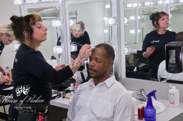 A behind-the-scenes moment with Aaron Brown in hair and makeup prior to the show. 5