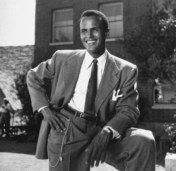 AMERICA'S FIRST AFRICAN-AMERICAN MALE PERFORMER TO WIN THE EMMY!: Here is the legendary star Harry Belafonte with his 1960 Emmy Award as Outstanding Performer for his 1959 television music special 