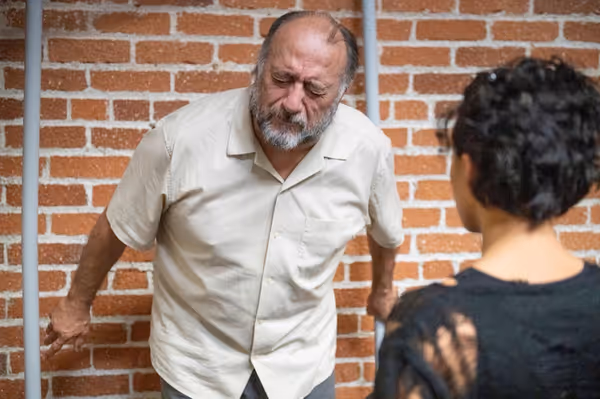 Una confronts the past as Ray watches from a distance in a tense moment from Blackbird. 6