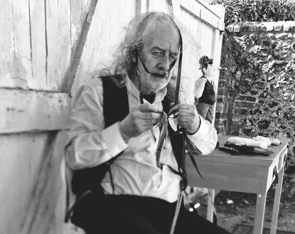 Krapp studying his tapes. 1