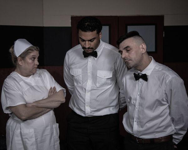 Nurse Ratched scolds her staff -- Aides Warren and Williams. 5