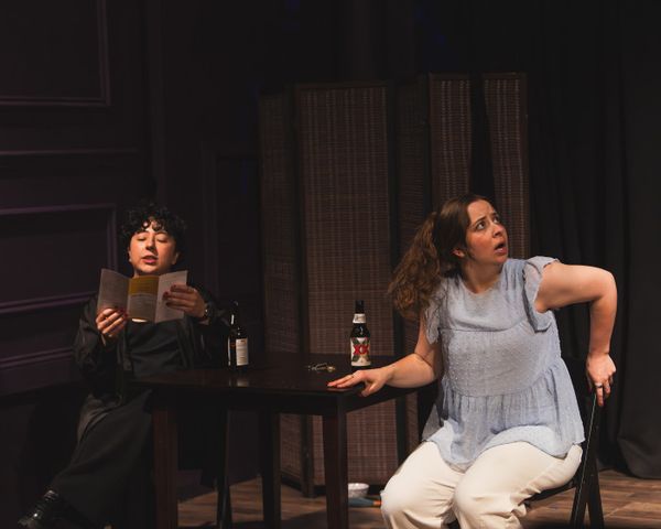Melanie Santos Cordero as Callie and Bridgette Dove as Sarah share a moment as a neighbor   s noise interrupts, menu in hand. Photo by MCP Photo.   3