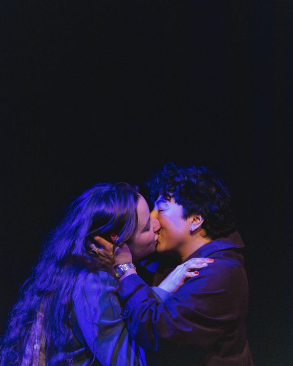 Melanie Santos Cordero as Callie and Bridgette Dove as Sarah share a kiss in the final moment of Stop Kiss. Photo by MCP Photo. 11