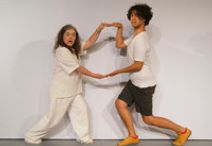 TWO PARROTS AND A SANDCASTLE