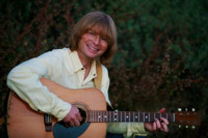 A John Denver Christmas show poster