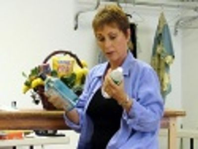 Amanda McBroom (as Kate) tries to decide between liquor and water
before sitting dow Photo