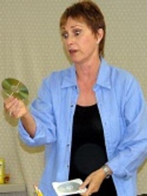 Amanda (as Kate) puts on a CD left for her by
her former writing partner Photo