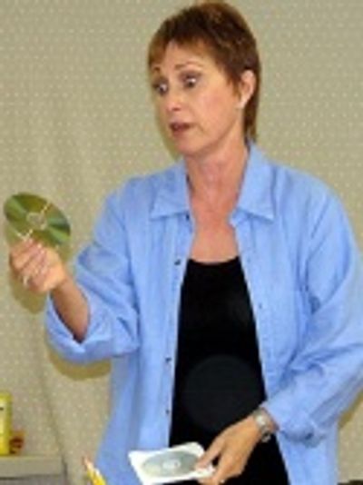 Amanda (as Kate) puts on a CD left for her by
her former writing partner Photo