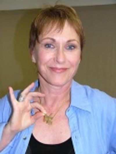 Amanda shows off her "A Woman Of Will"
custom necklace. Photo