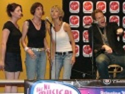 Jimmy Bennett sings "Driving Home (The Rage)" backed up
by the Shaggs (l-r) Dana, Ja Photo