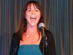 Sara Schmidt singing "Easy To Be Hard" Photo