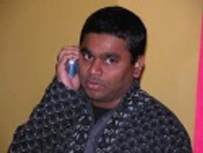 A R Rahman takes a call from a well-wisher Photo