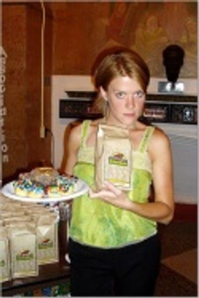 Producer Suzy Myers shows off the Crumbs Bakery Cupcakes and
Dale & Thomas Popcorn g Photo