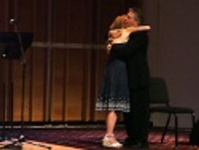 Both songs brought tears to Menken's eyes. Kerry leaves the
stage after an embrace w Photo