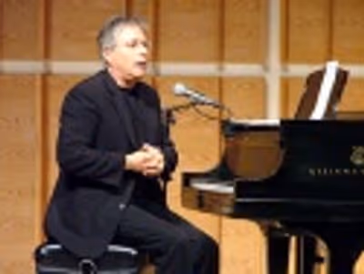 Alan concluded the evening with a medley of songs from his career Photo