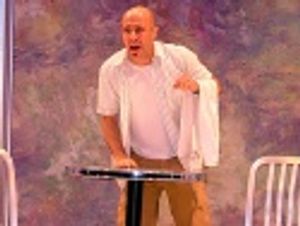 Jeff portrays a waiter at a german restaurant. Photo