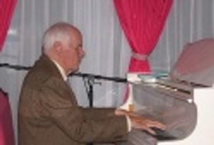 
Galt MacDermot, who wrote the music for "Hair" led the
audience in singing 2 of hi Photo