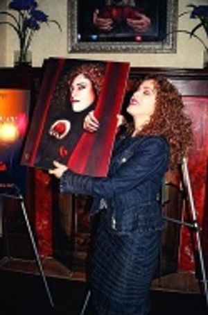 Holding up the painting for those in the back...  Photo