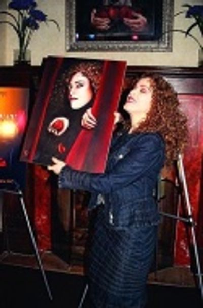 Holding up the painting for those in the back...  Photo