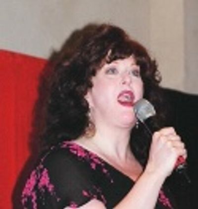 Liz McCartney singing "Talk Amongst Yourselves"  Photo