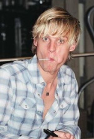 Jeffrey enjoying a lollipop as well while signing autographs Photo