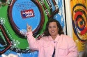 Rosie shows off one of her paintings... Photo