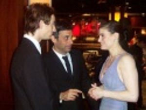 Andy Pellick and Joe Mantello talking to Idina Menzel  Photo