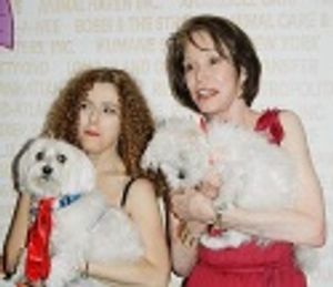 The two hosts pose with some new furry friends... Photo