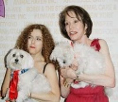 The two hosts pose with some new furry friends... Photo