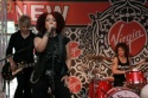 Eric Hauptman (Guitar), Stephanie Lippman (aka Militia) Vocals, and LaFrae Scy (Dumme Photo