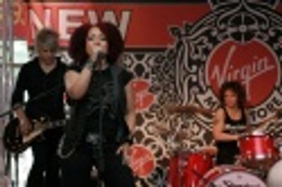 Eric Hauptman (Guitar), Stephanie Lippman (aka Militia) Vocals, and LaFrae Scy (Dumme Photo