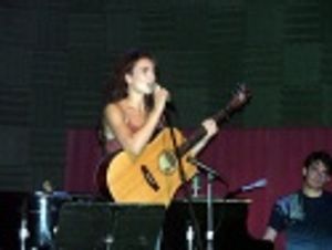 Laura introduces a song she wrote, inspired by her friend
Darcy called "The Waitress Photo