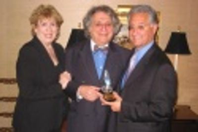 Drama Desk President William Wolf (center) presents the Workshop's special award to B Photo