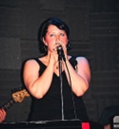 Natalie singing "Walk Away" Photo