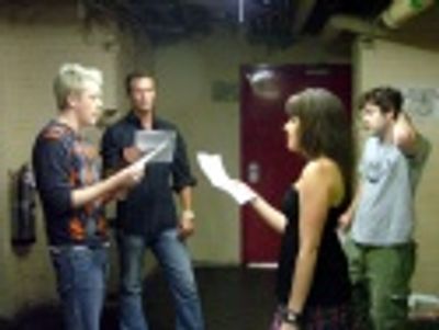 Michael, John and Jenna rehearse the new closing number
while Damon looks on Photo