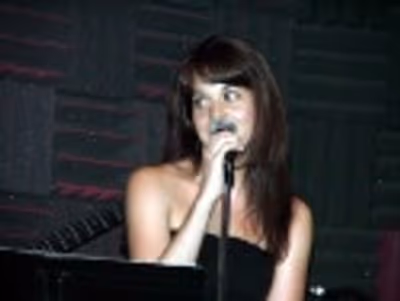 Jenna preps the audience for a "cut" number from BARE Photo
