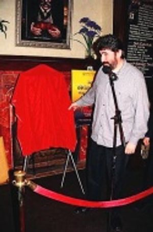 Alfred preparing to unveil his portrait Photo