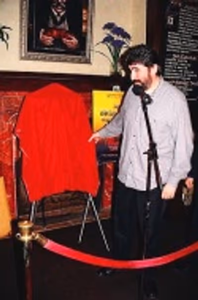 Alfred preparing to unveil his portrait Photo