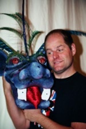 Philip Solomon shows off the head of the Tsunami Dragon Photo