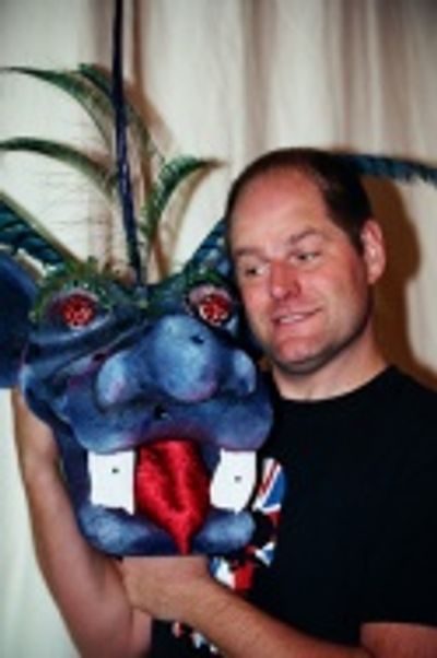 Philip Solomon shows off the head of the Tsunami Dragon Photo