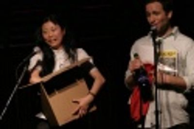 Deborah S. Craig and David Rossmer auctioning off a prop from Martin Short: Fame Beco Photo