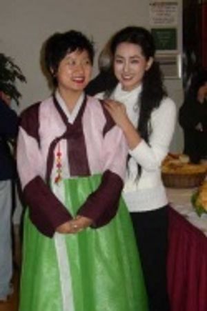 Choreographer Insook Choi shows off her traditional Korean dress to Hyo Sung Kang Photo
