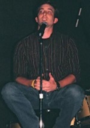 Peter Matthew Smith singing "She's Always a Woman"  Photo