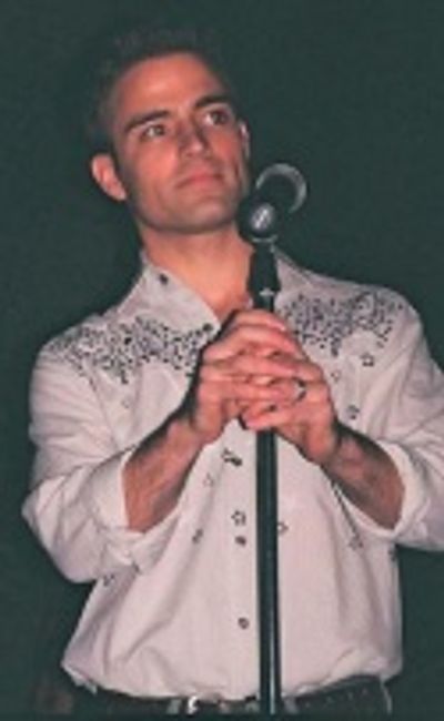 Todd Michel Smith getting ready to
sing "River in the Rain"  Photo