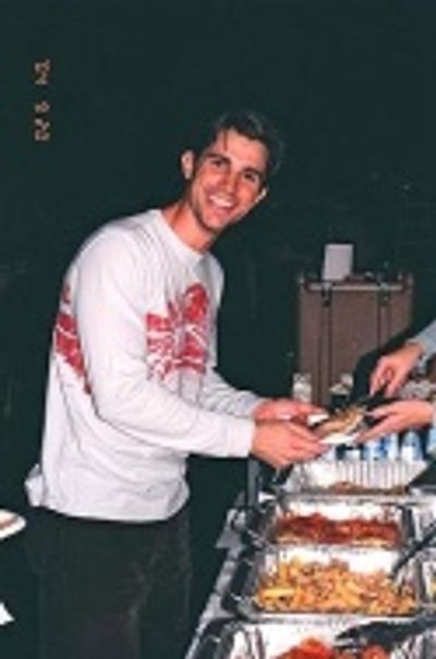Matt Cavanaugh takes a moment to enjoy the scrumptious Italian cuisine graciously pro Photo