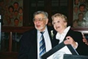 Biff Liff and Angela Lansbury looking at the spot on the wall illuminating the newest Photo