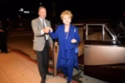 MGM star Debbie Reynolds arrives on red carpet in classic 1940 car Photo