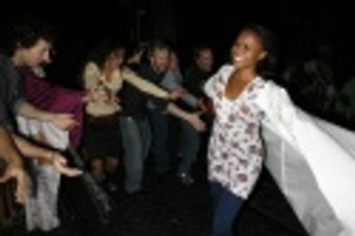 Nikki Renee Daniels in front of Daphne Rubin-Vega and other cast members Photo