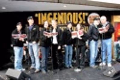 Drowsy Chaperone cast members treat Times Square  to a holiday carol outside the Marr Photo