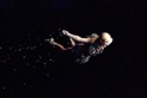 Cathy Rigby surprises the audience as she takes flight and sprinkes the audience with Photo